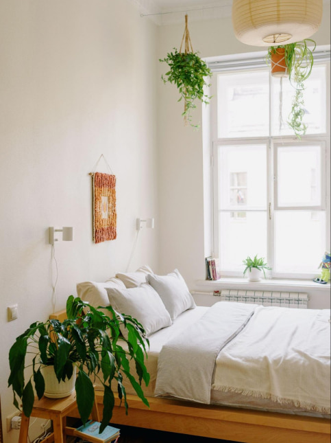 A vintage wall hanging above the bed for bedroom wall decoration - Beautiful Homes