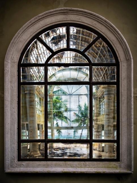 Arch window grill design with white border - Beautiful Homes