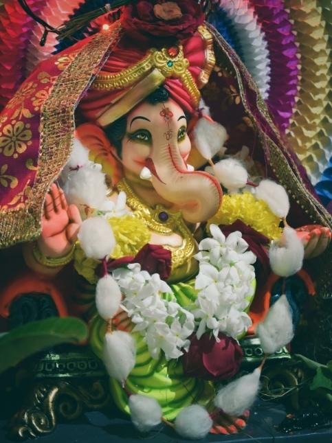 Ganpati idol decoration with flowers & origami - Beautiful Homes