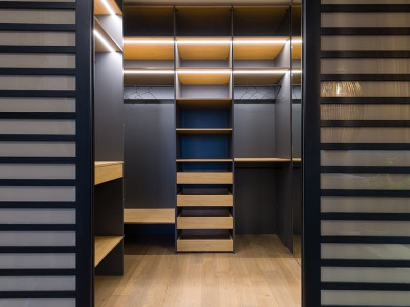 Black walk-in closet with LED strips - Beautiful Homes